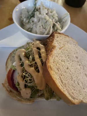 Avocado basil on sourdough with coleslaw  at Living Kitchen - South End in Charlotte