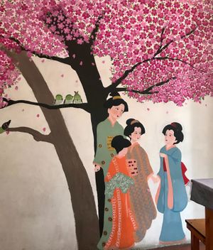 The walls are painted with flowers at Sakura Shokudou in Oaxaca