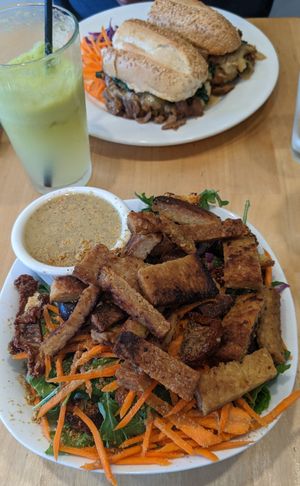 Caesar salad with tempeh, seitan cheese steak, and live lemonade at Good Karma Cafe in Red Bank