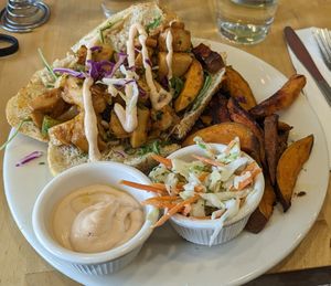 Lobster roll with sweet potato fries, coleslaw, and chipotle aioli. at Good Karma Cafe in Red Bank