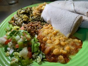 From their Vegan Buffet (Wed/Thurs):  Azifa (Brown Lentils), Chopped Collard Greens, Kik Aicha (Split Chick Peas), Red Lentils w/ Berbere Sauce,  Salad, Injera at Gojo Ethiopian Cuisine in Grand Rapids