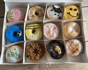 Strawberry and creme, creamy raspberry crumble, vanilla cookie, mr happy, blue cookie, mango passion, raspberry flower, double stuffer rasperry, confetti, chocolate speculoos, chocolate chip and pistace raspberry. at Dunkin' in Goes