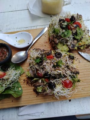Garlic mushroom avocado toast on pumpernickel at Elixir Spot in Puerto Vallarta