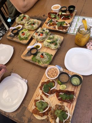 Mushroom avocado toasts, birria and pastor tacos  at Elixir Spot in Puerto Vallarta