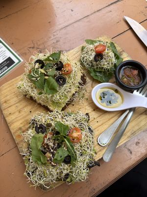 Garlic Mushroom toast and Hummus Avocado toast on pumpernickel  at Elixir Spot in Puerto Vallarta