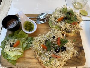 Avocado hummus toast + garlic mushroom toast  at Elixir Spot in Puerto Vallarta