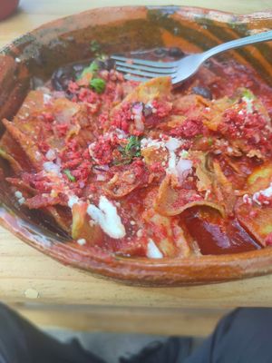 Chilaquiles rojos. (Ya casi a punto de acabarse) at Quilitl in Mexico City