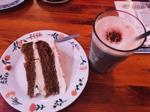 Vegan carrot cake & home brewed chai latte! Tasted really good! ❤️ at Cafe Babalu in Reykjavik