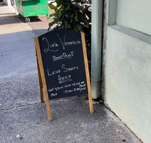 Sign by mud hen water  at Little Vessels Donut Co in Honolulu