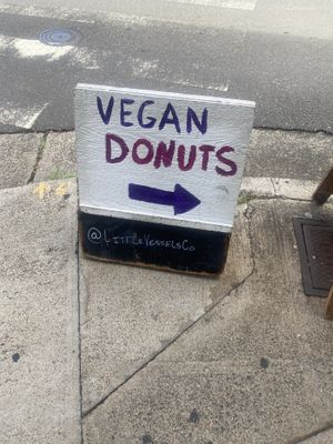 Sign on corner to guide you to donuts  at Little Vessels Donut Co in Honolulu