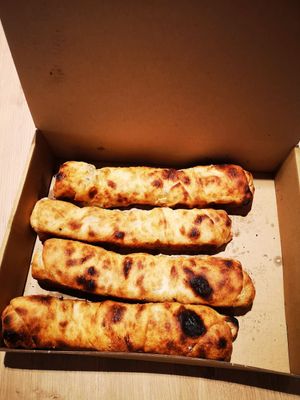 Vegan pizza rolls at Hiša Pod Gradom in Ljubljana