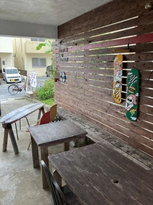 outside sitting area (there’s another table tough)  at Rotton 六屯 in Chatan