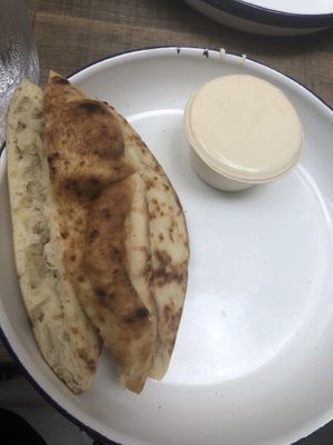 Tahini and pita on the side   at Miznon in Central Singapore
