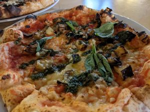 Vegan pizza with pesto and aubergine at Kommune - Food Court in Sheffield