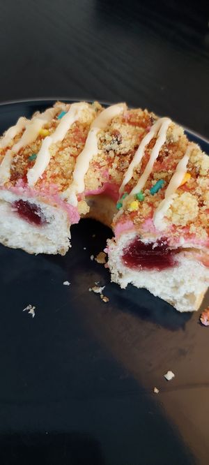 Birthday cake doughnut has jam filling at Kommune - Food Court in Sheffield