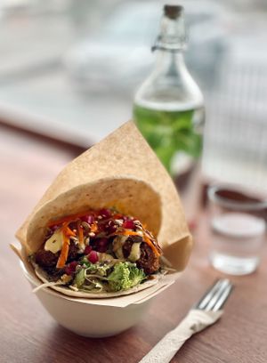 Butternut squash falafel, broccoli salad, marinated carrots, pomegranate & preserved orange aioli at Chickpea  in Reykjavik