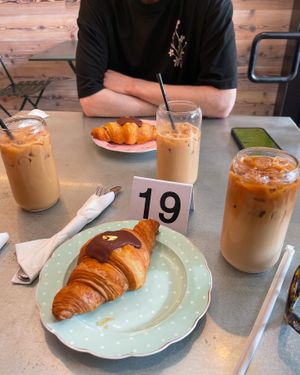 Chocolate orange croissant and oat milk iced coffee  at Chaumont Vegan in Beverly Hills