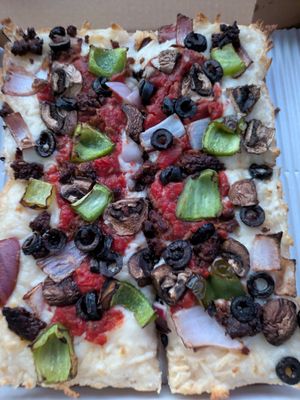 Vegan sausage pizza with veggies added at Guerrilla Pizza  in Las Vegas