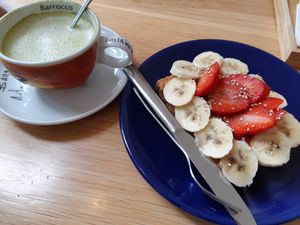Matcha tea and peanut butter toast (under the banana and strawberries) at La Pastelería del Duque in Madrid