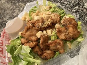 Vegan Caesar salad with lemon pepper chicken added  at Hoza Pizzeria in Oakland