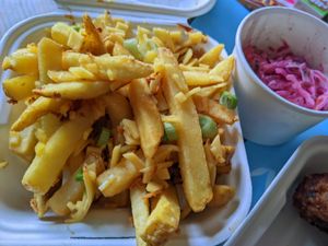 Loaded cheeze and onion fries and slaw at FEAST by L&B in Folkestone