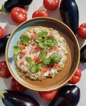 Baked eggplants with tomatoes and tahini. Photo by Israel Grill at Israel Grill in Krasnodar