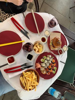 KFC burger, “prawn” tempura in a bowl, sushi plate, chips  at 123V Browns in London