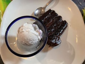 Chocolate cake and coconut ice cream. 😋 at Chilaquiles Factory in Cedar Park