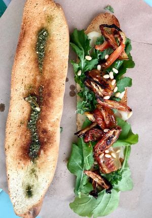 Bagertte Mediterranea. Potato cheese, seasoned tomatos, pine nuts, home made pesto and arugula.  at La Yaqueria in Valladolid