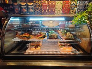 Various omnivorous items with a vegan bread item on the right at La Bohême in Cordoba