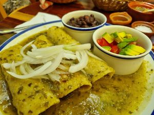 Enchiladas with green sauce  at La Cueva del Chango in Playa Del Carmen