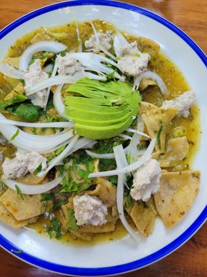 Green chilaquiles with almond ricotta at La Cueva del Chango in Playa Del Carmen