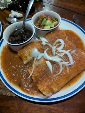 Enchiladas (3) served with boiled beans and pico de gallo, stuffed with chaya, mushrooms, nopal cactus
or poblano chili strips and your choice of red, green or mole sauce. at La Cueva del Chango in Playa Del Carmen
