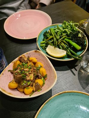 Fried gnocchi in mushroom sauce and green veggies at Pastan Barbican in London