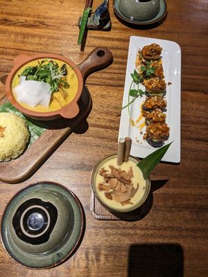 Mushroom aubergine with peanut sauce. Mushroom, tofu, potato, tofu ham green curry, mango smoothie at Sangha Vegetarian Restaurant in Da Nang