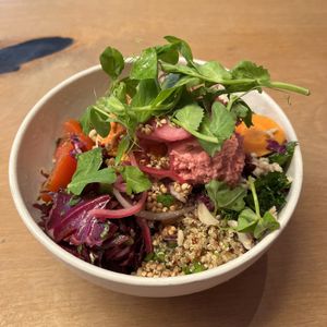 Big salad bowl with a lot of fresh veggies and colourful dips  at Café Glad in Aarhus