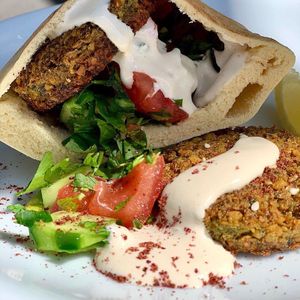 Homemade falafel (no garlic) in pita with chopped tomatoes, cucumber, mint, parsley & tahini sauce, quinoa & salad  at Zest in Nicosia