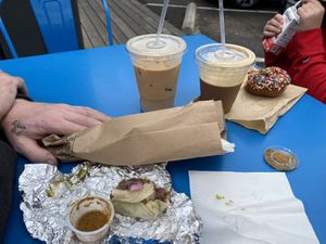 V taco ($3) from Tacodeli, Cold Brew w/ Half & Half ($4.15), Moon Raker w/ Oat milk ($5.40) Honest juice ($1) Chocolate sprinkles donut ($3). Total $21.50 w/tips   at Summer Moon Coffee - W Anderson Ln in Austin