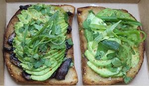 2 slices of Gluten-Free toasted bread with organic avocado, arugula, green onions, salt, pepper & lime. Feel free to add your favorite of a protein. at Plant Base Cafe in Santa Fe