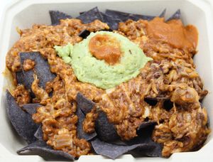 Loaded Nachos
House-made blue corn tortilla chips topped with your choice of protein, cheese, and hot sauce. Served with a side of scoop guacamole. at Plant Base Cafe in Santa Fe