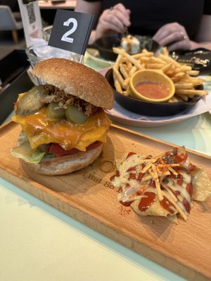 Junk burger with complimentary corn chips and spicy sauce  at 2foods - Shibuya Loft in Tokyo