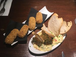 Croquetas de cepa y trufa , ensaladilla vegana at PÖTSTOT in Barcelona