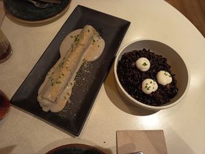 Canelon trufado y arroz negro at PÖTSTOT in Barcelona