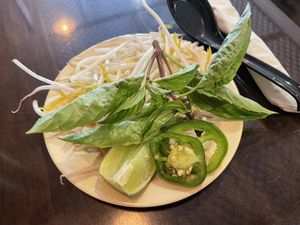 Here’s the tiny plate of add-ons that costs an extra $2.75 for vegans. The omnivores get this free. Unfair!!   at Pho Company Noodle House in Deland