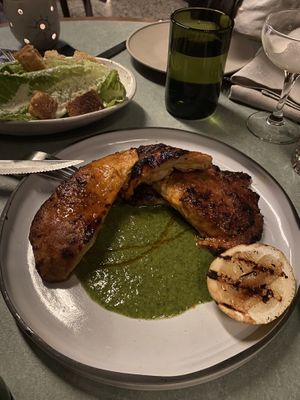 Peri peri vegan chicken and Caesar salad in the back   at Lona Misa in South Yarra
