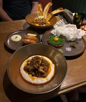 Cocido (front), croquettas (middle left), tartare (middle right), moqueca (back)  at Lona Misa in South Yarra
