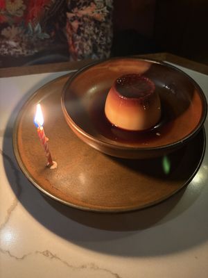 Flan Mexicano (burnt caramel and citrus) with a complimentary birthday candle    at Lona Misa in South Yarra