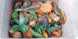 P.E.T (a la carte which comes with bigger portion and side of rice) Spicy sauce, but flavorful. Vegetables were well cooked. Tofu had a nice consistency. $9.95 at Thai Vegan in Albuquerque