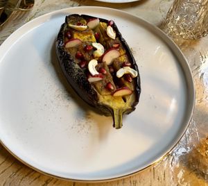 Starter: aubergine with mango and turmeric powder and pomegranate seeds   at Vrindaa in Rome