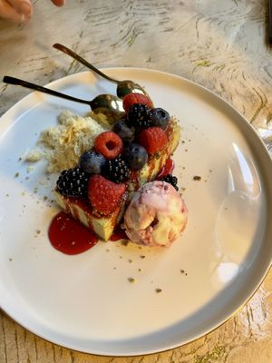 Pistacchio cheesecake with berries on top and a sort of shaved halva and amarema icecream   at Vrindaa in Rome